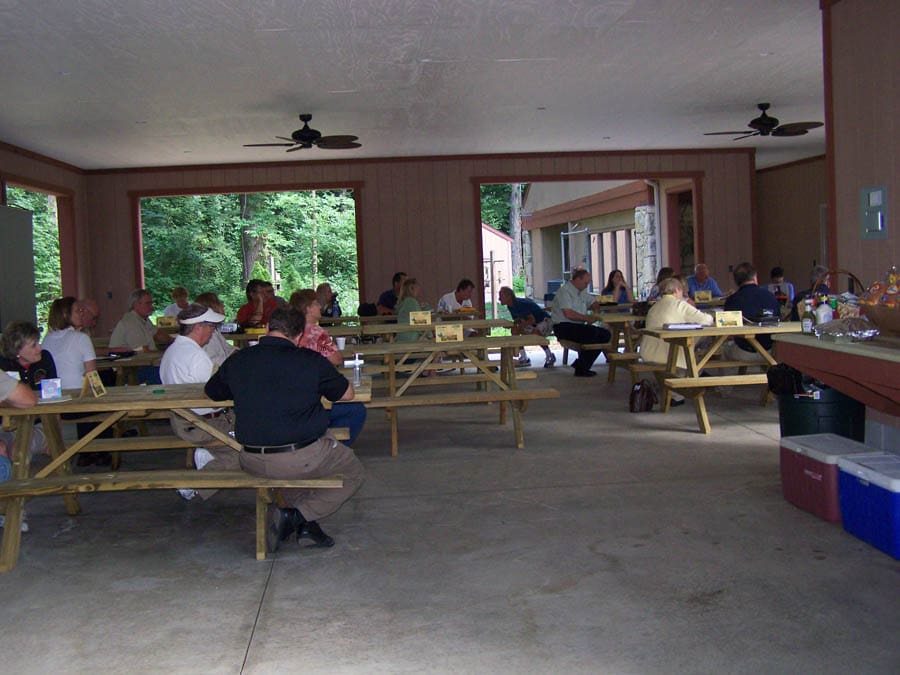 people at an event inside picnic shelter
