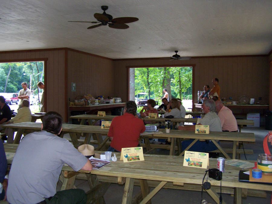 people at an event inside of picnic shelter